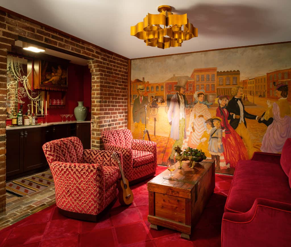At home speakeasy room with painted wall mural