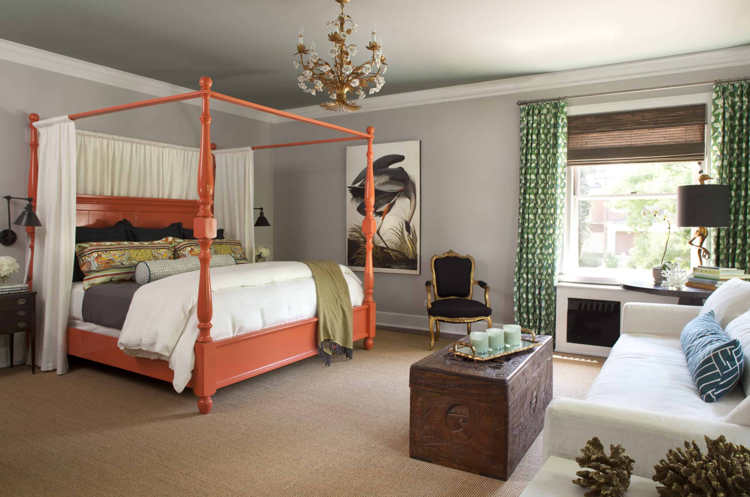 Curated, inviting master bedroom with painted four poster bed