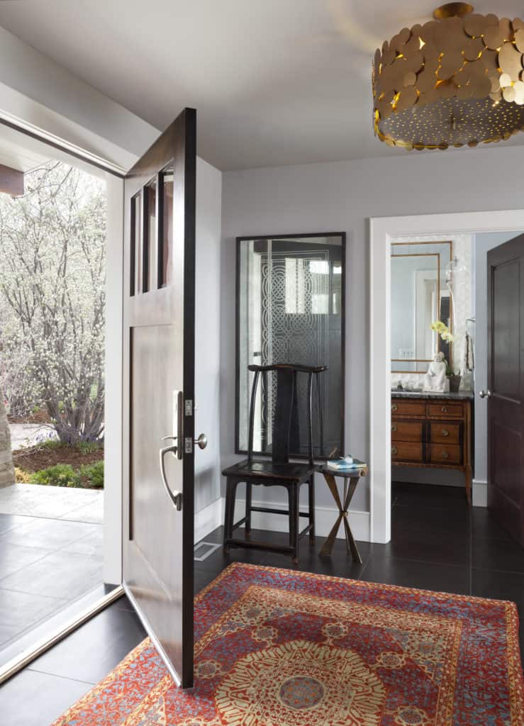 Mixing old and new décor in home entryway by denver interior decorator