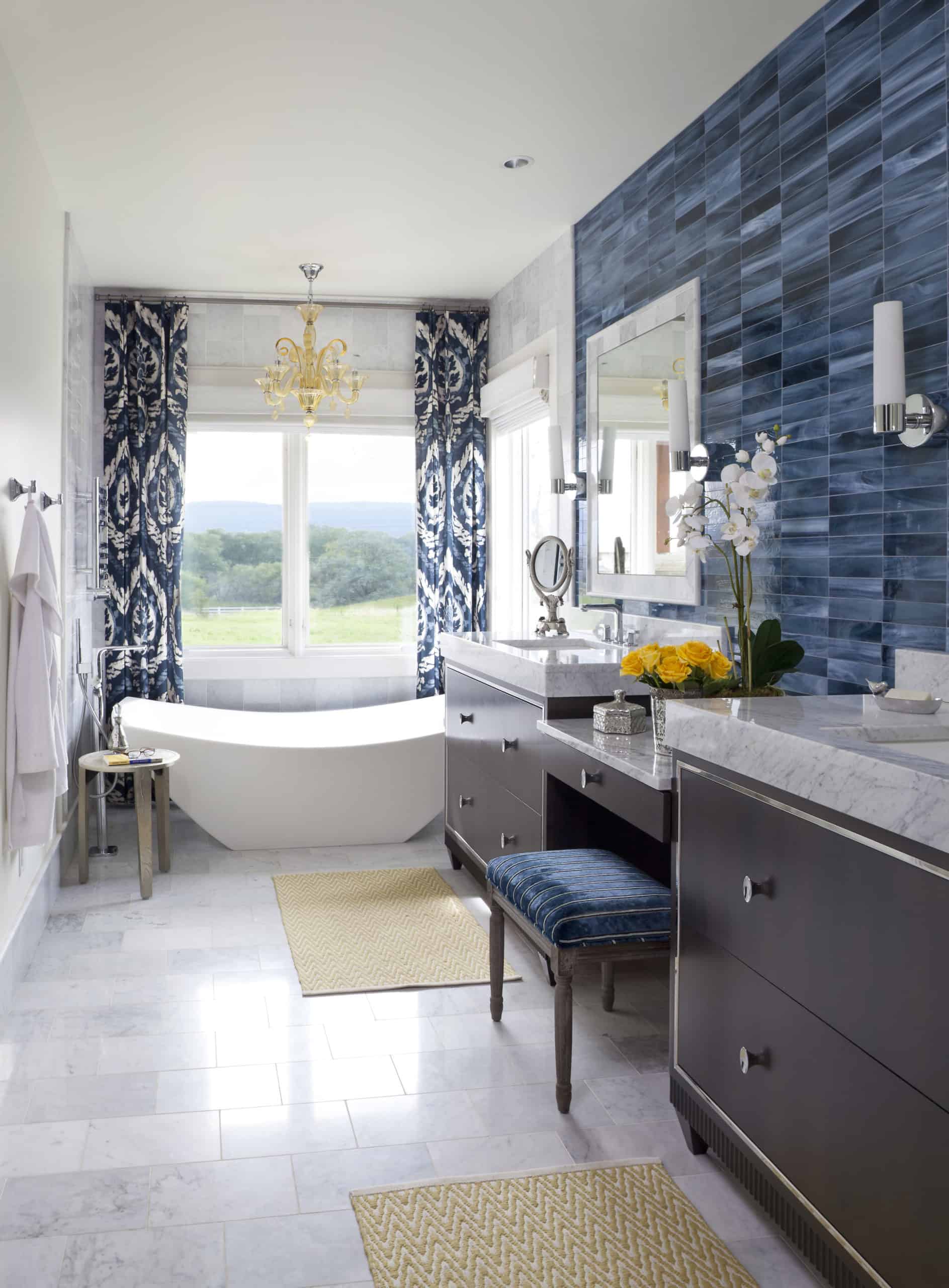 Blue tiled bathroom, freestanding tub, double vanities, beautiful blue and white draperies in master bath