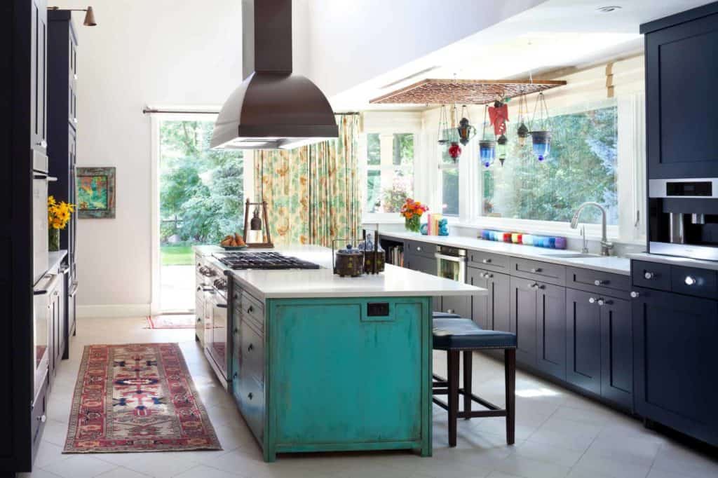 Green kitchen island cabinets with navy kitchen cabinets