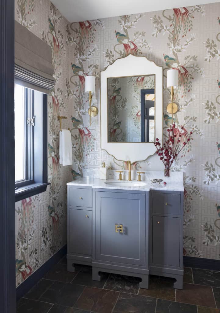 Unique Powder room wallpaper, vanity and brushed brass mirror