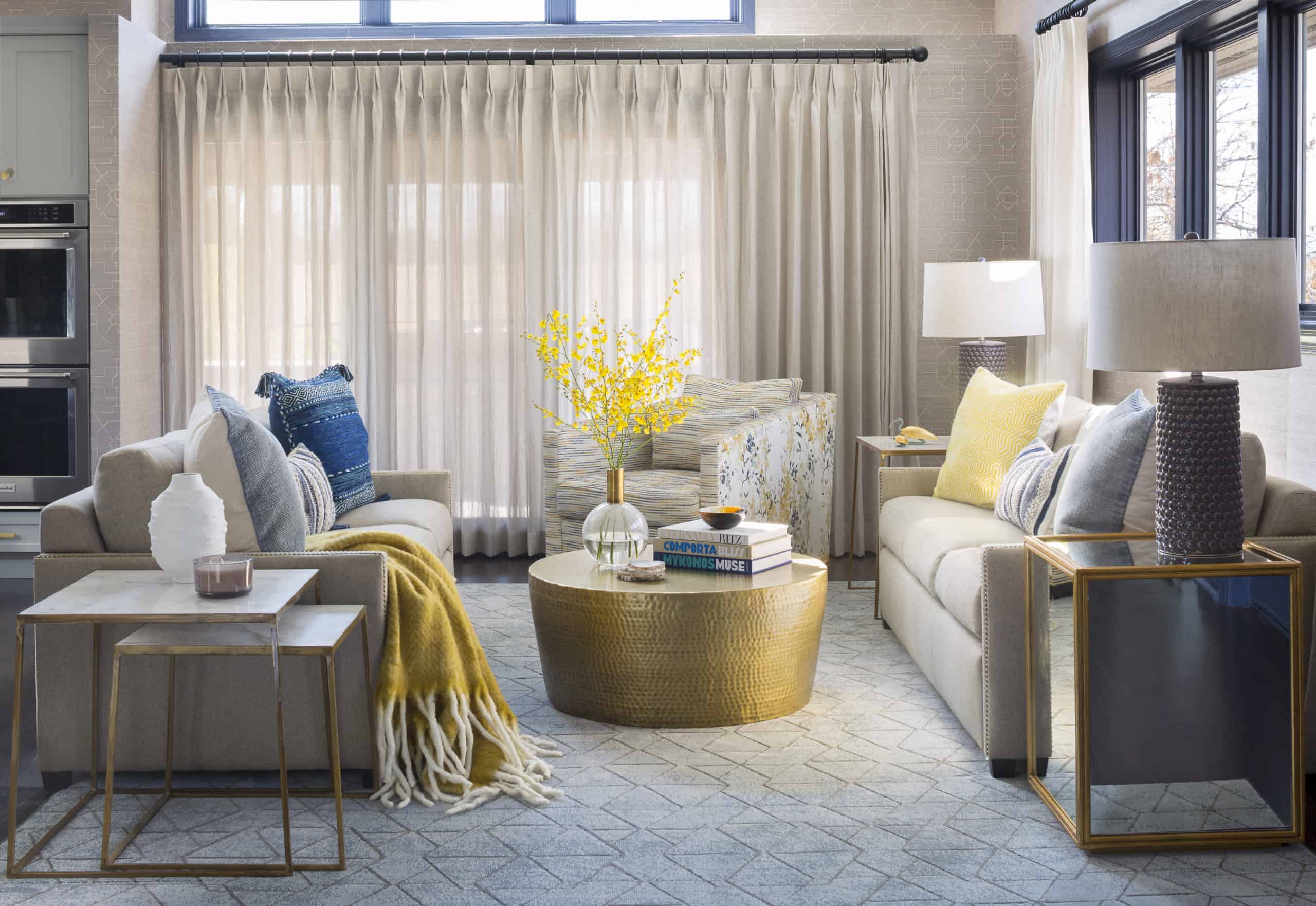 Contemporary family room furnishings with hammered gold coffee table