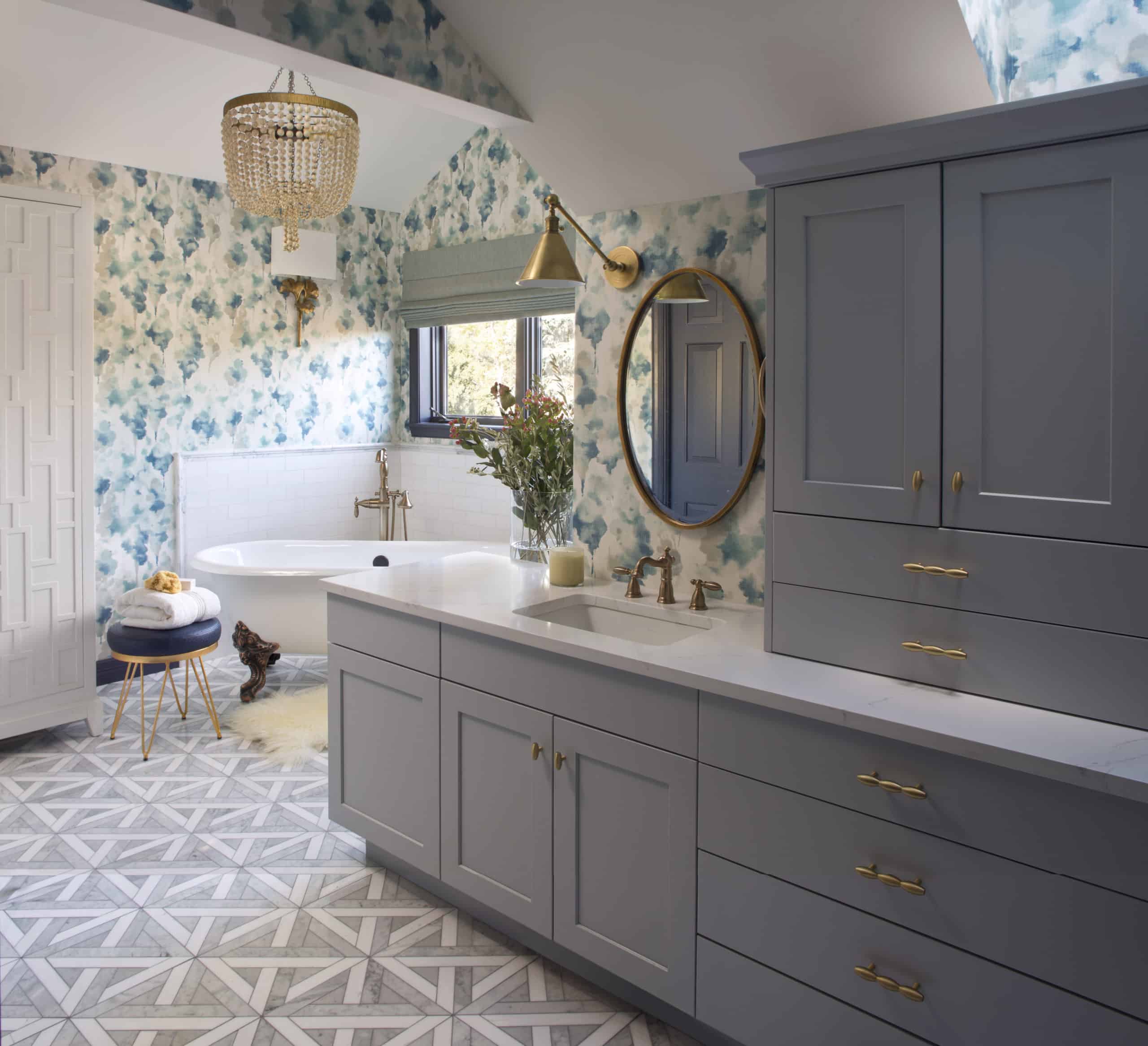 Spa-like master bath with sweet wallpaper and beaded chandelier
