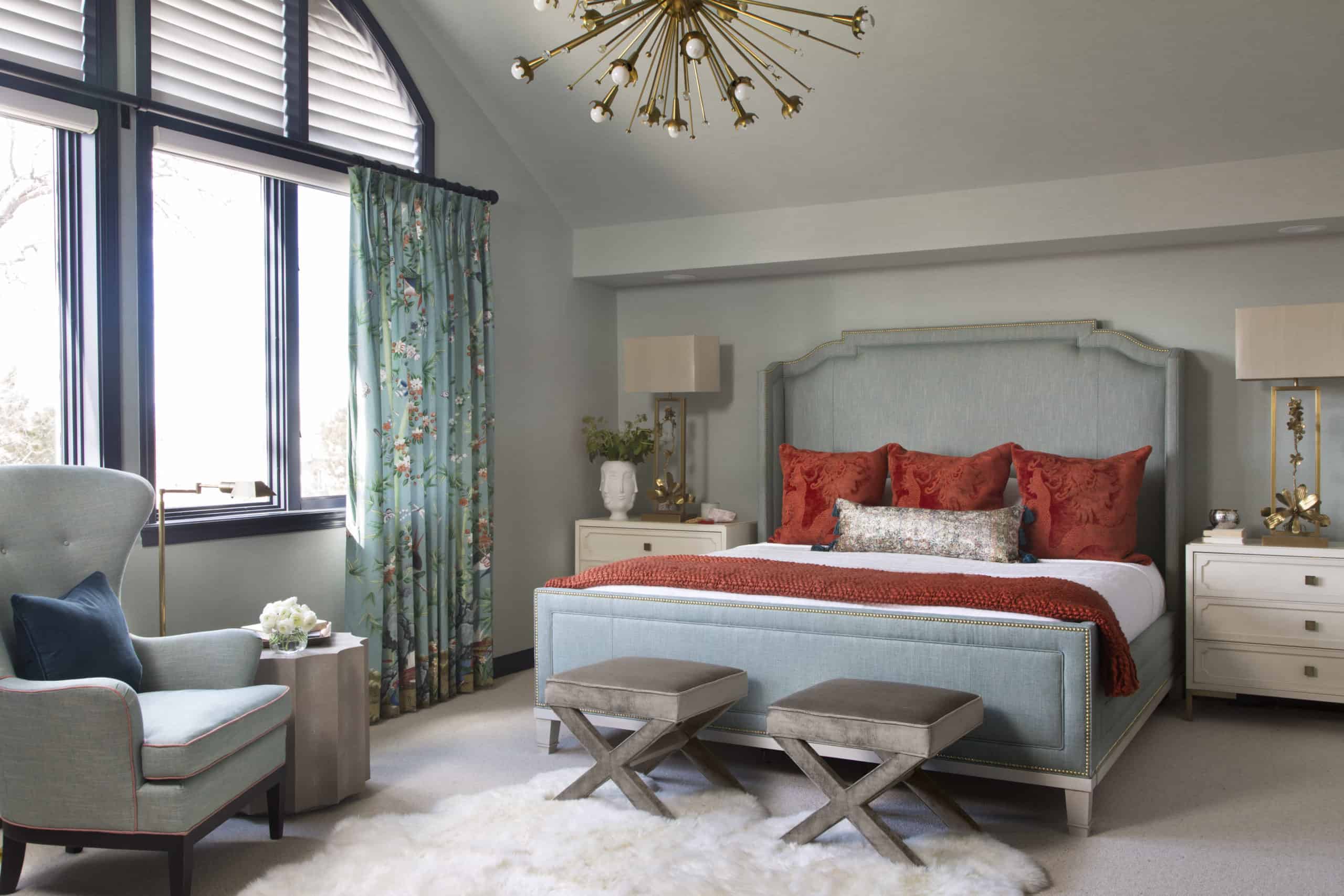 Lovely master bedroom with sputnik light fixture from interior designer denver co