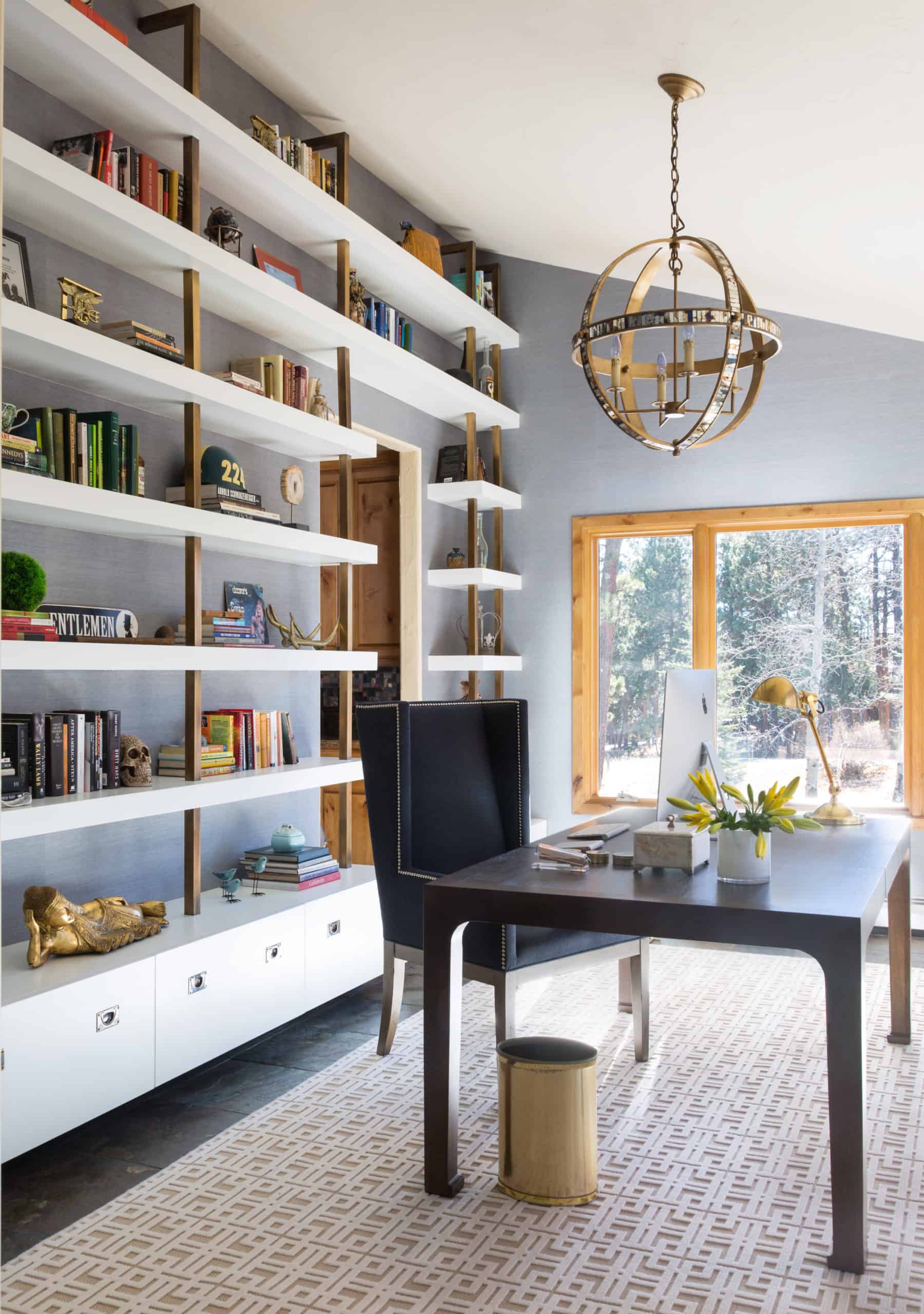 Modern office with modern bookshelf design by interior designers in Colorado
