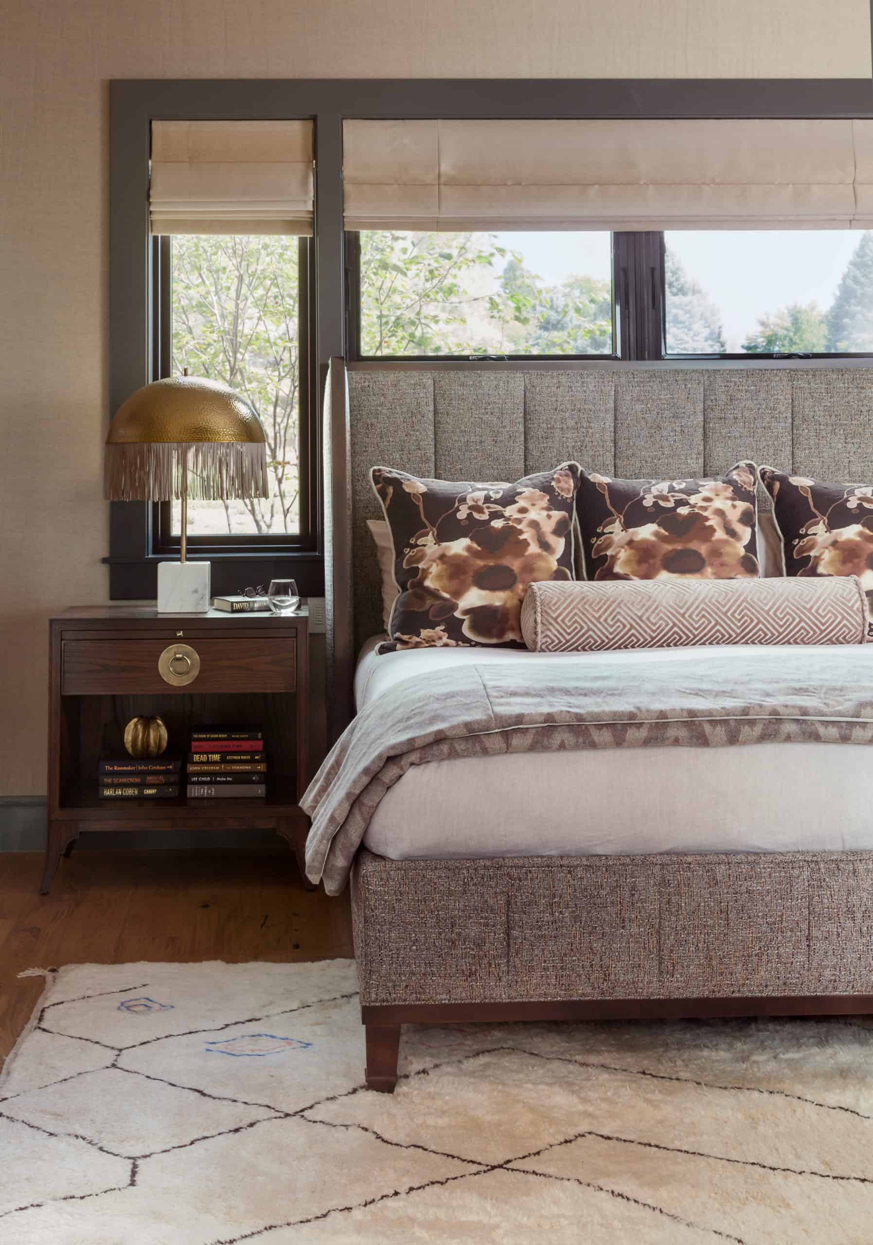 Rustic Reimagined style in neutral color bedroom furnishings with metal accents and bedside table lamp