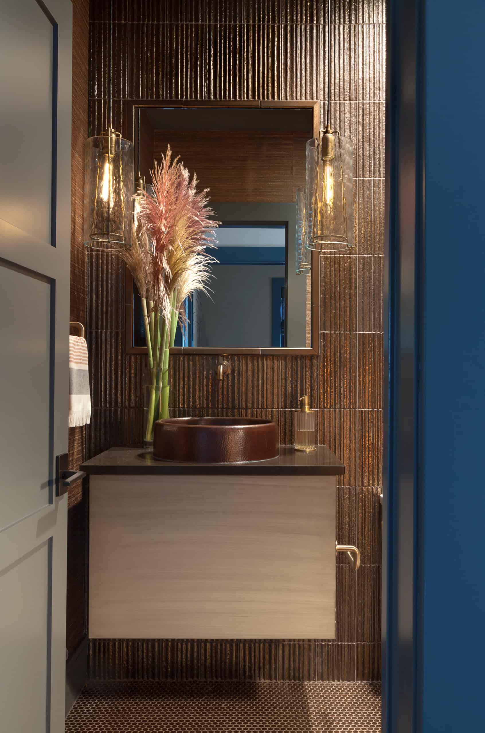 Ultra modern powder room with mixed metal wallpaper