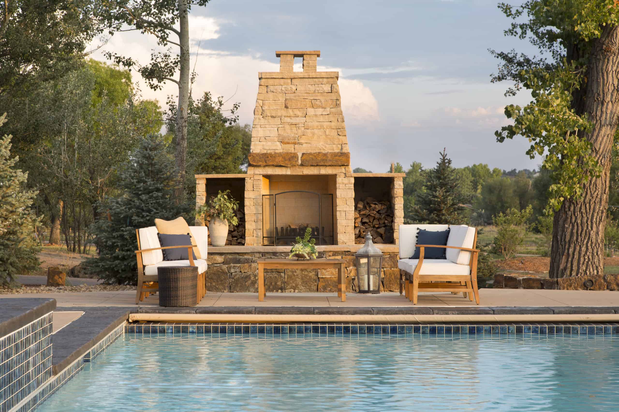 Swimming pool with fireplace by Denver interior decorator