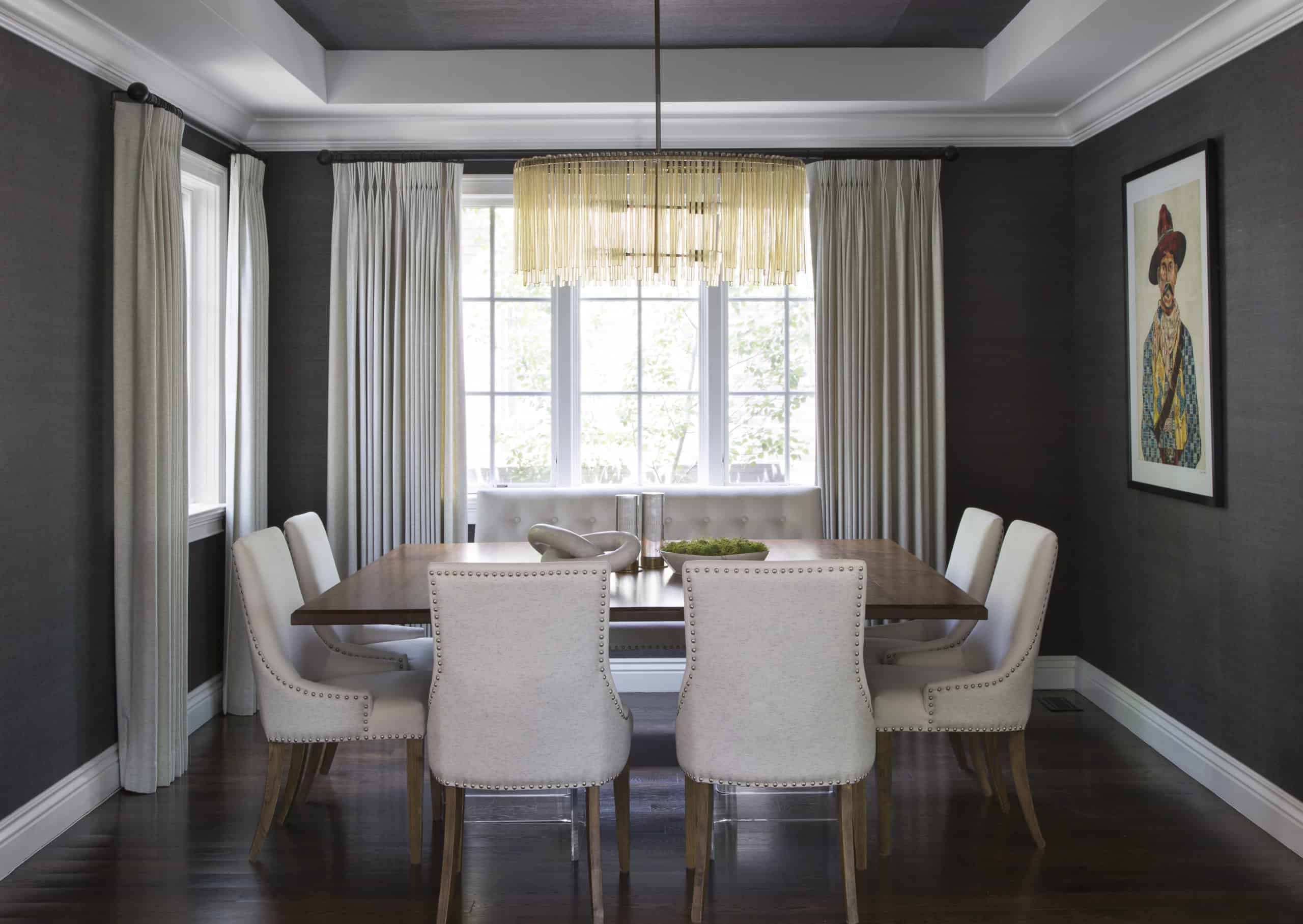 elegant modern dining room interior with square dining table and studded chairs