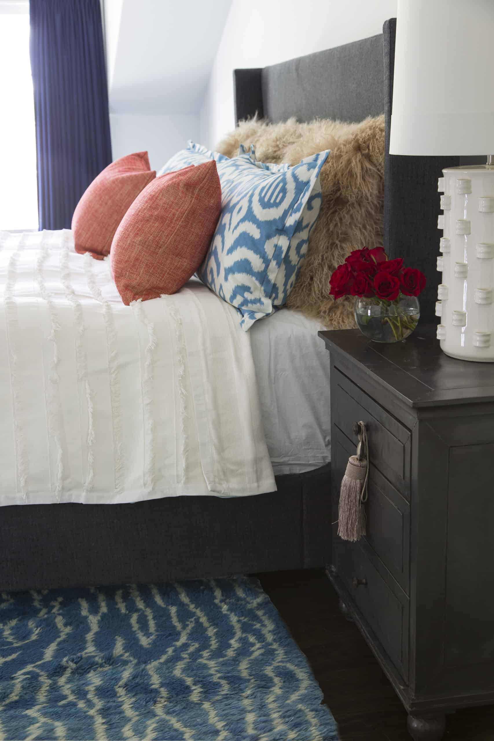 Colorful pillows in guest bedroom