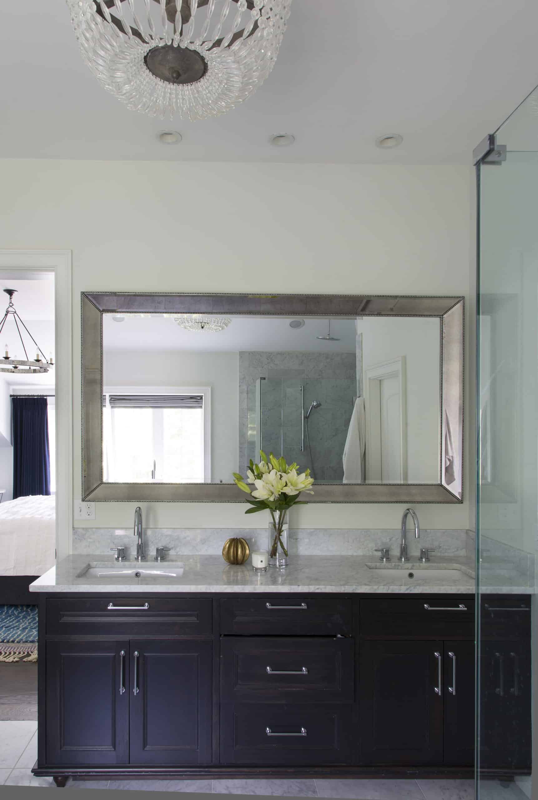 Primary Bath Double Vanity, Metal Mirror and Elegant Glass Chandelier