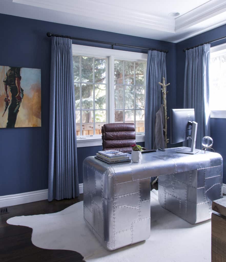 Home office with blue walls and draperies with metal desk by Andrea Schumacher Interior Design