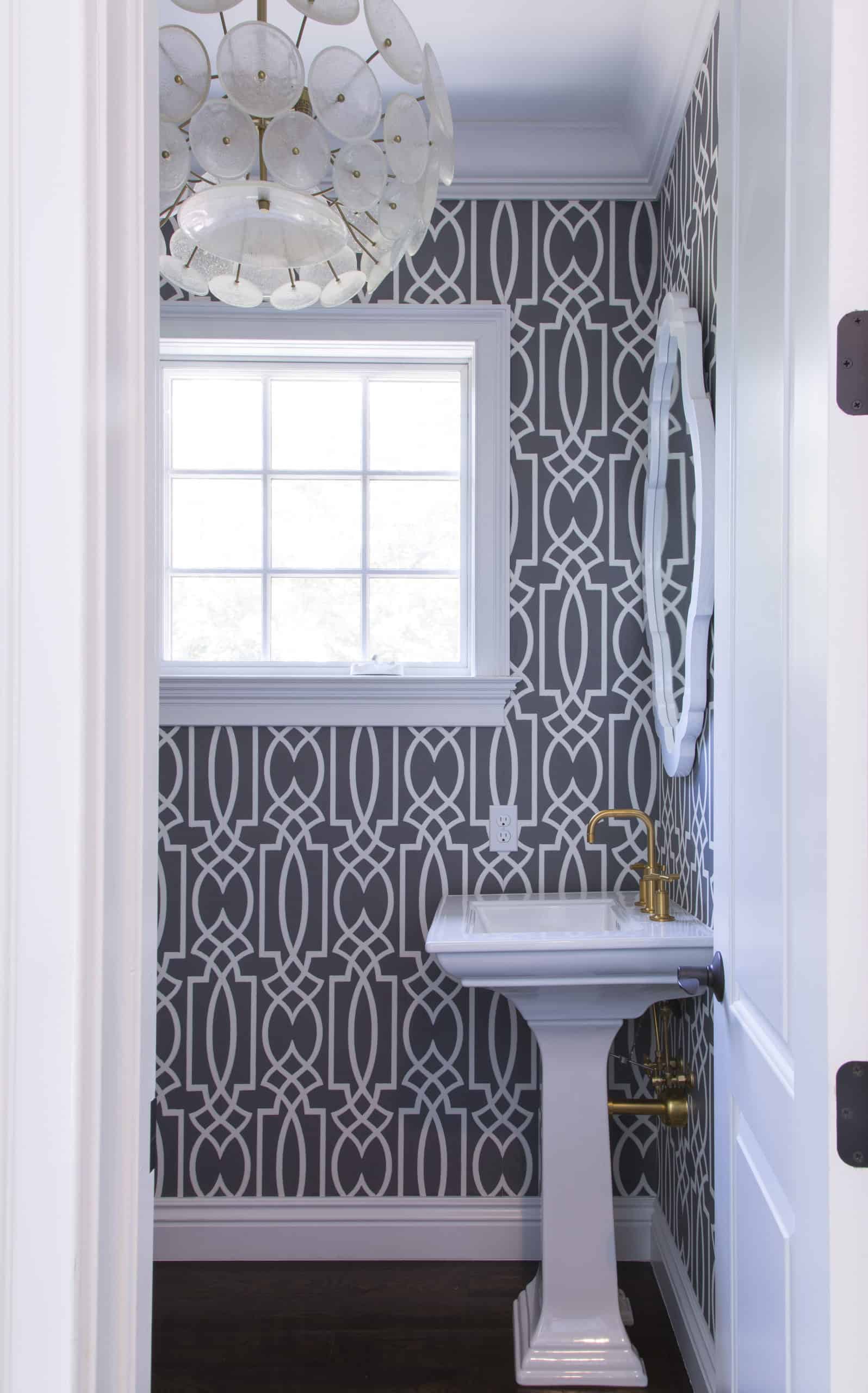 Gorgeous Powder Room with Chandelier and Gray and White Wallpaper