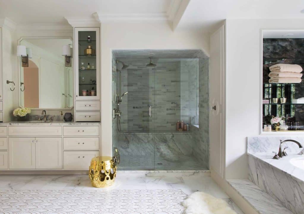 White bathroom with blush accents by interior architects Denver