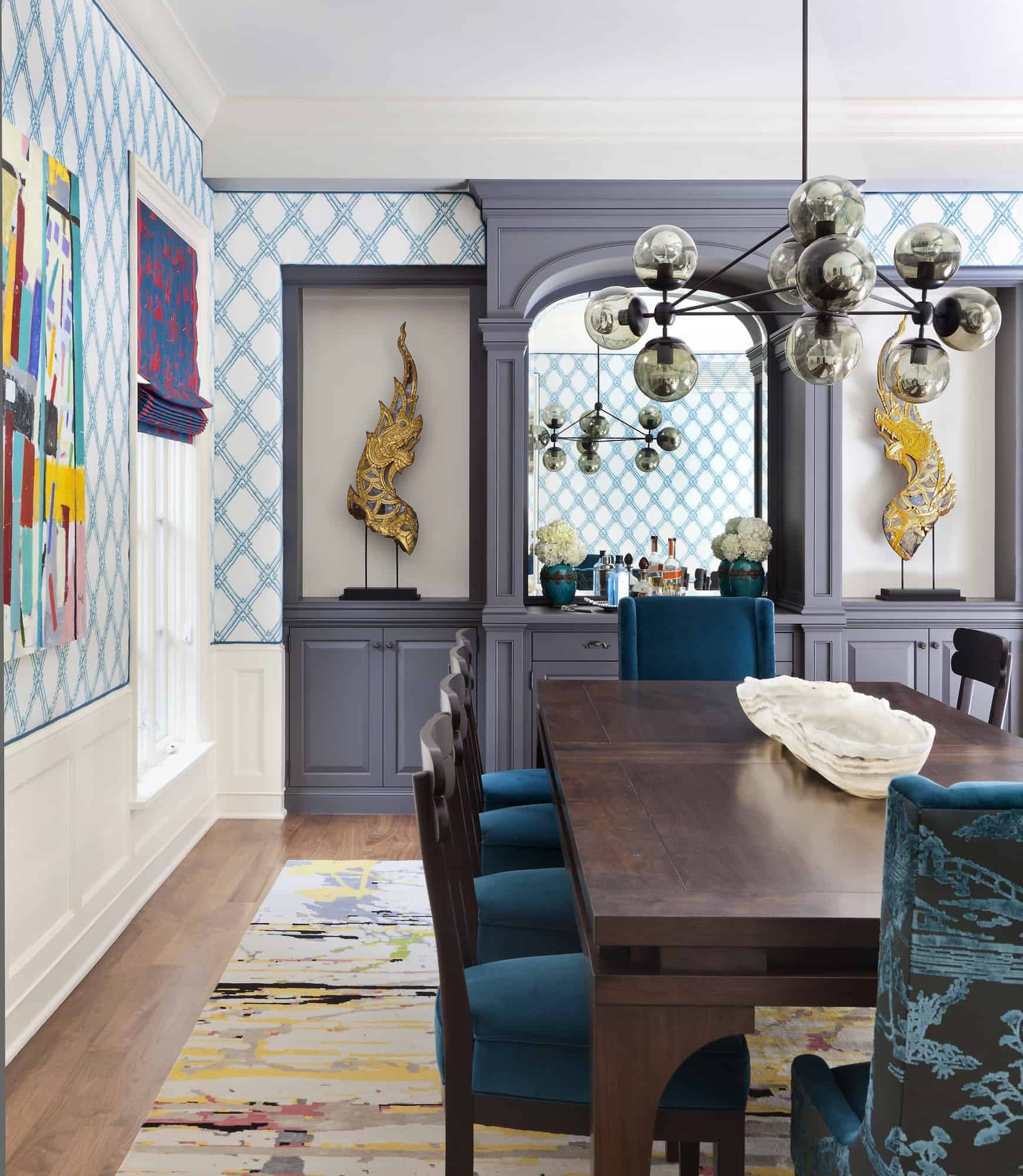 Bright blue dining room accents and gold details by amazing interior decorator in Colorado