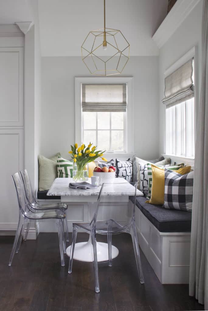 Breakfast nook with resin chairs and custom banquette