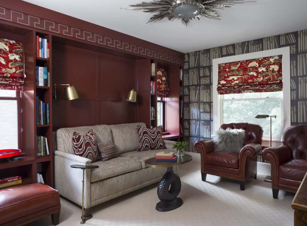 Sophisticated Study with Red Built-in Cabinetry and masculine decor
