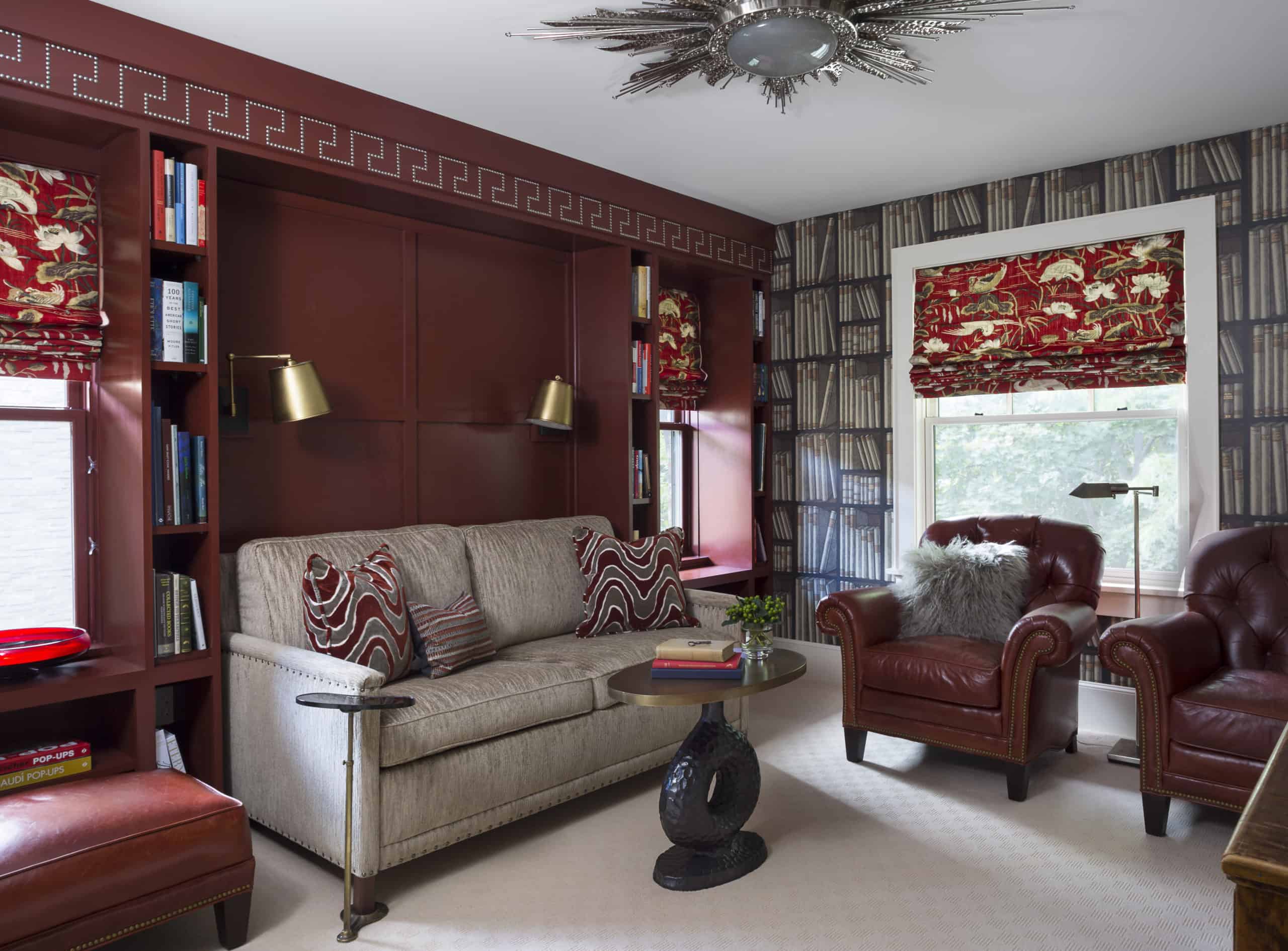 Sophisticated Study with Red Built-in Cabinetry and masculine decor
