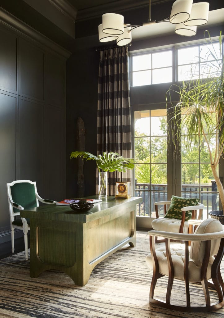 Cozy study with dark walls and striped drapery by interior designer colorado