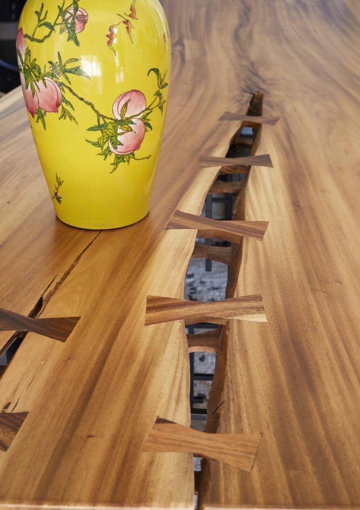 unique wood table with colorful oriental vase