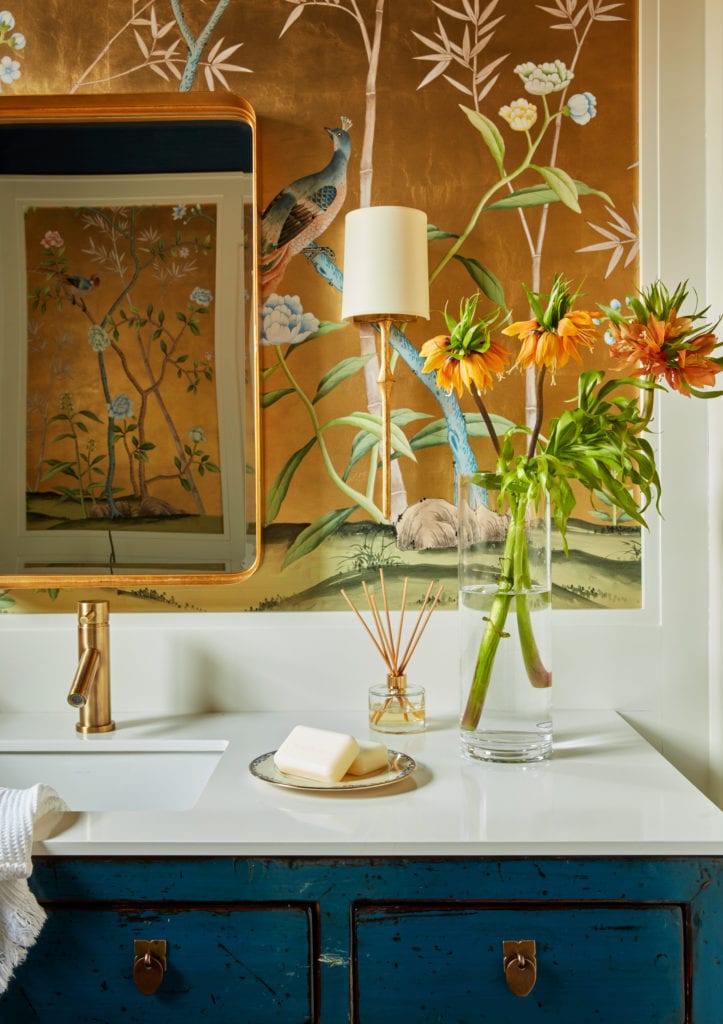 Colorful powder room with metallic wall paper