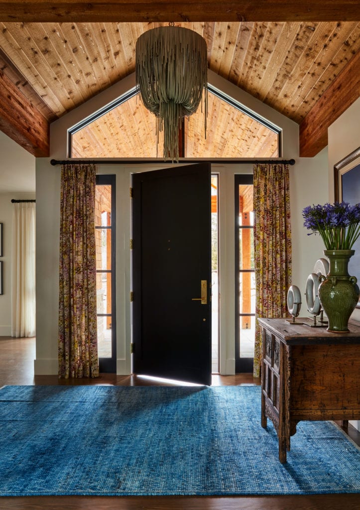 Lake house interiors and entry way with natural wood