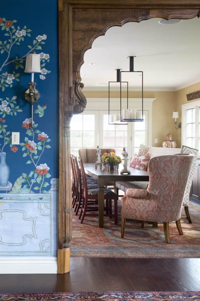 Curated dining room with custom chairs and repurposed antique entry