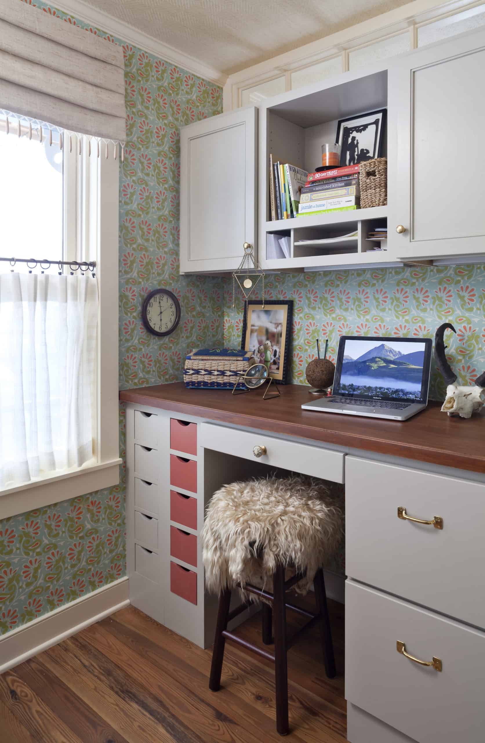 Feminine office space with built-in cabinetry