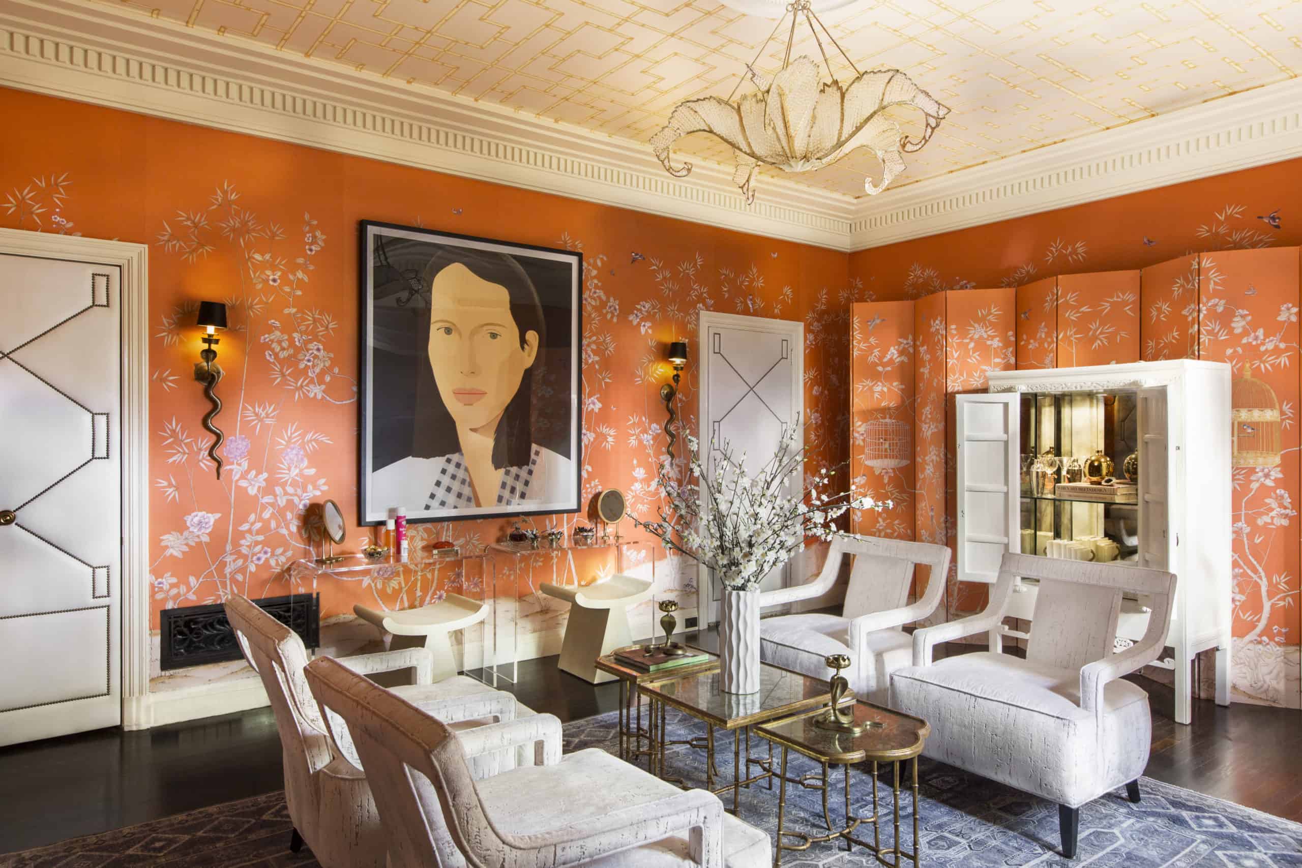 Greystone Mansion dining room with orange wallpaper, ceiling wallcovering, and wallpapered panel accents