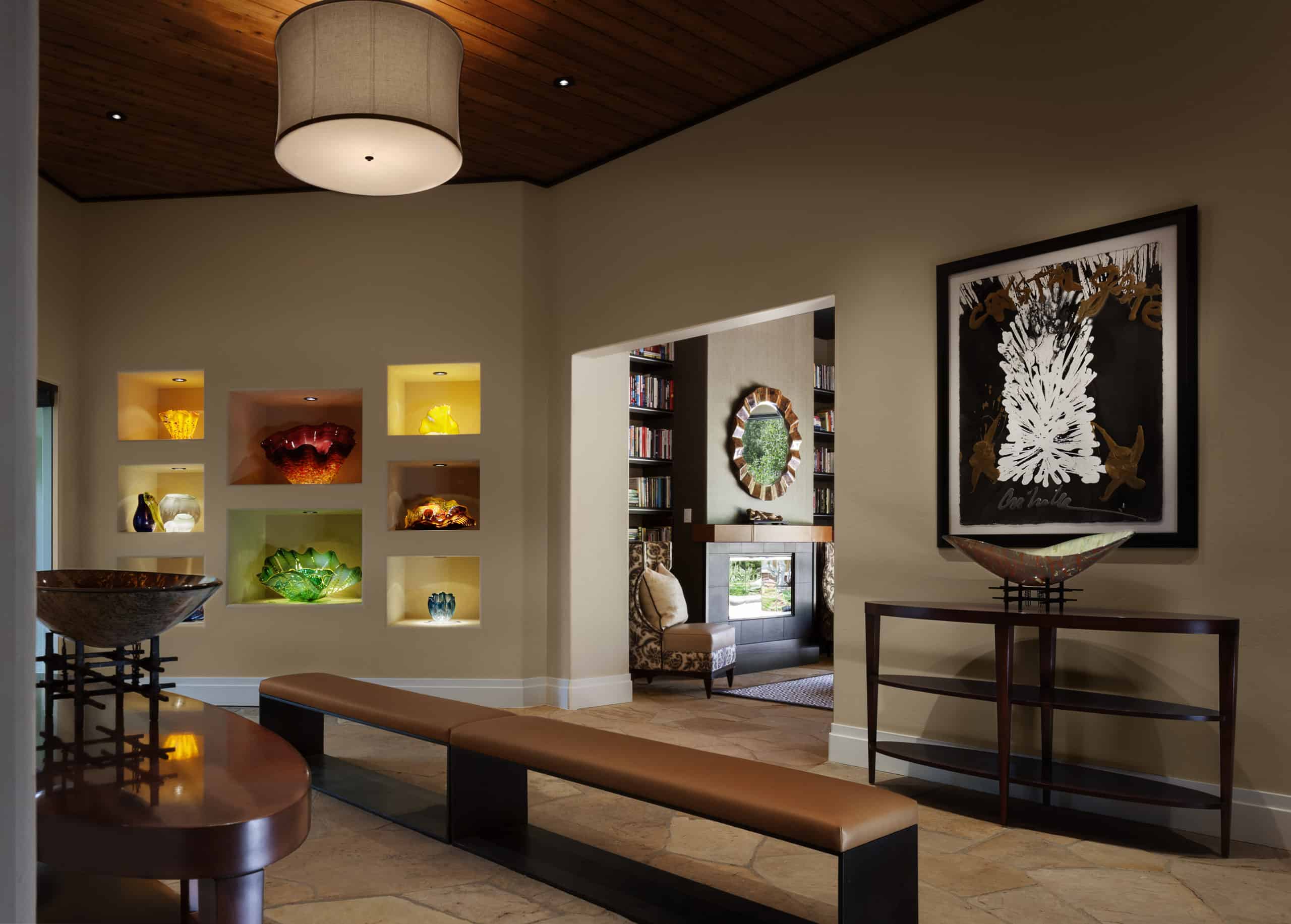 Artsy home entry crafted to display art and expensive decor