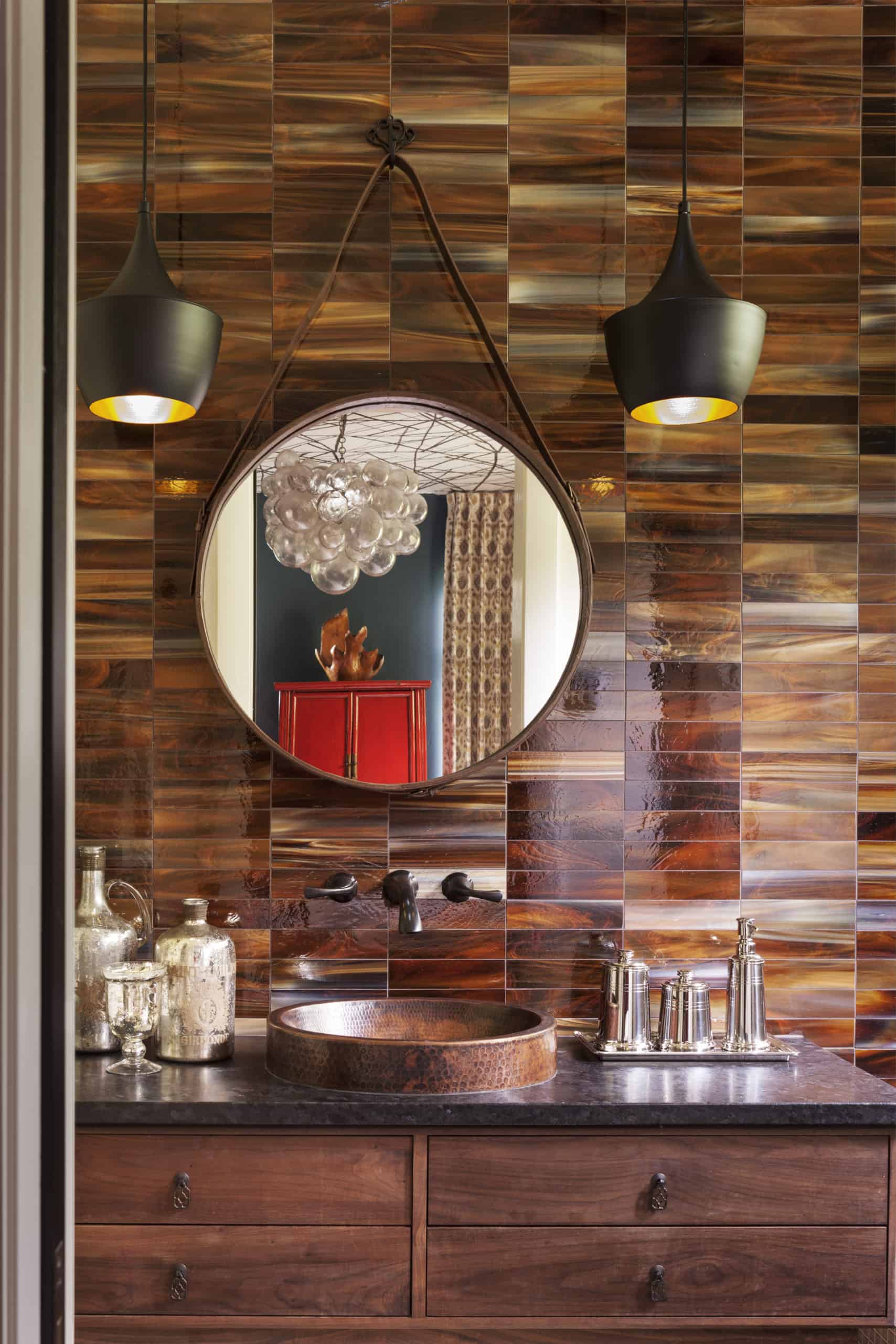 Powder room with unique high end finishes and gorgeous tile by Denver kitchen designers
