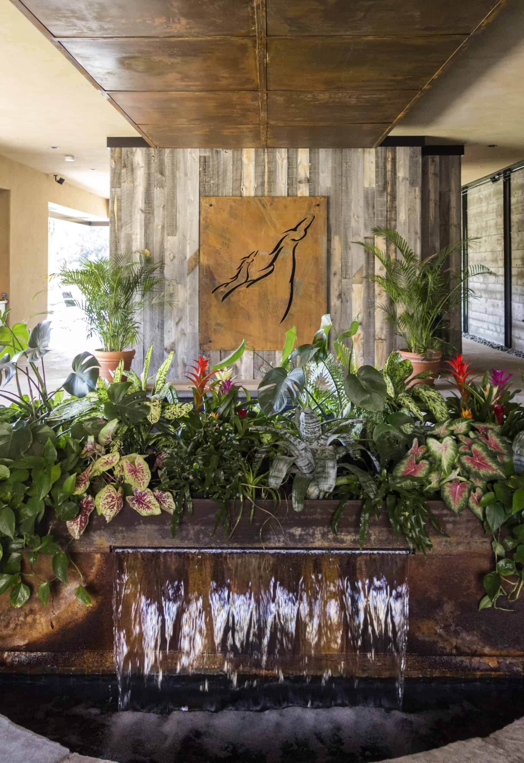 Beautiful indoor metal fountain design by interior designers Colorado