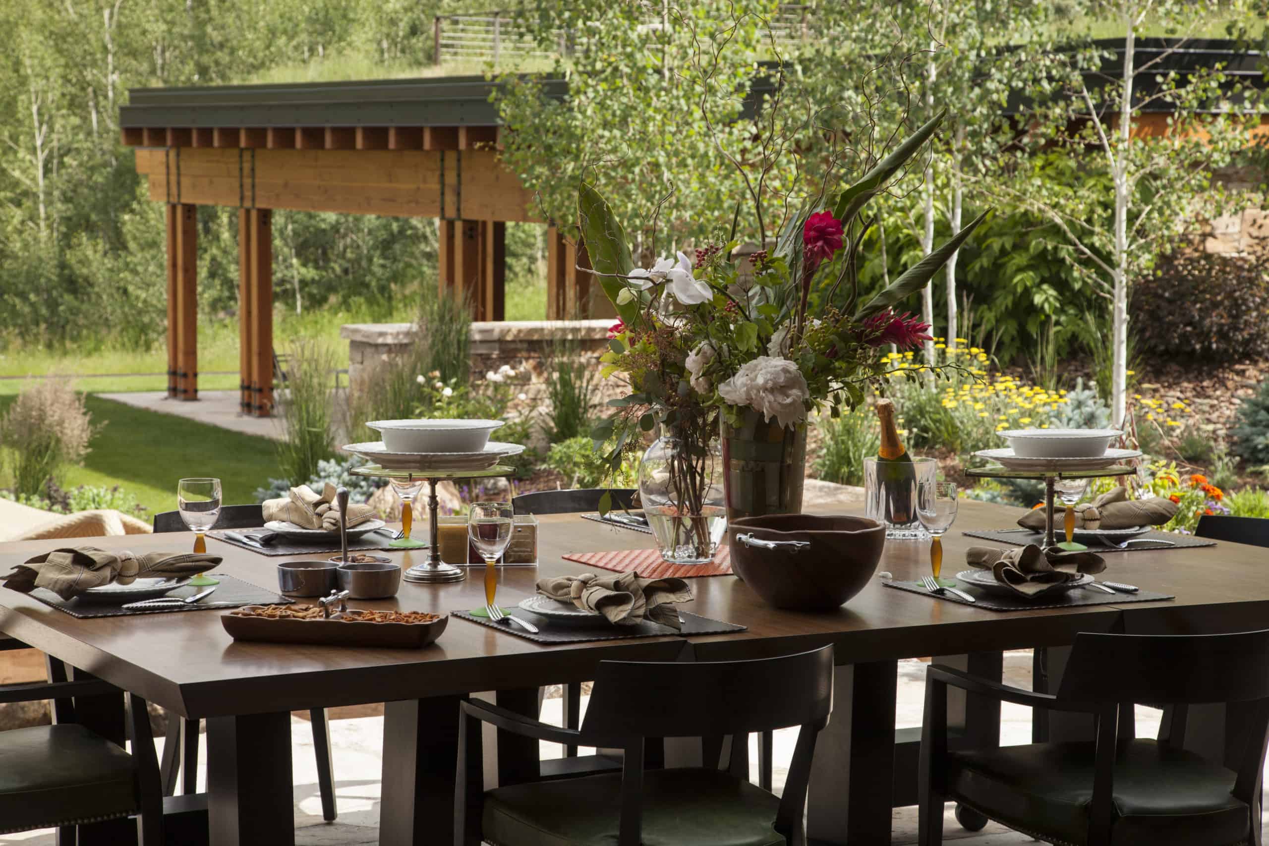 Outdoor dining space with moving glass wall system