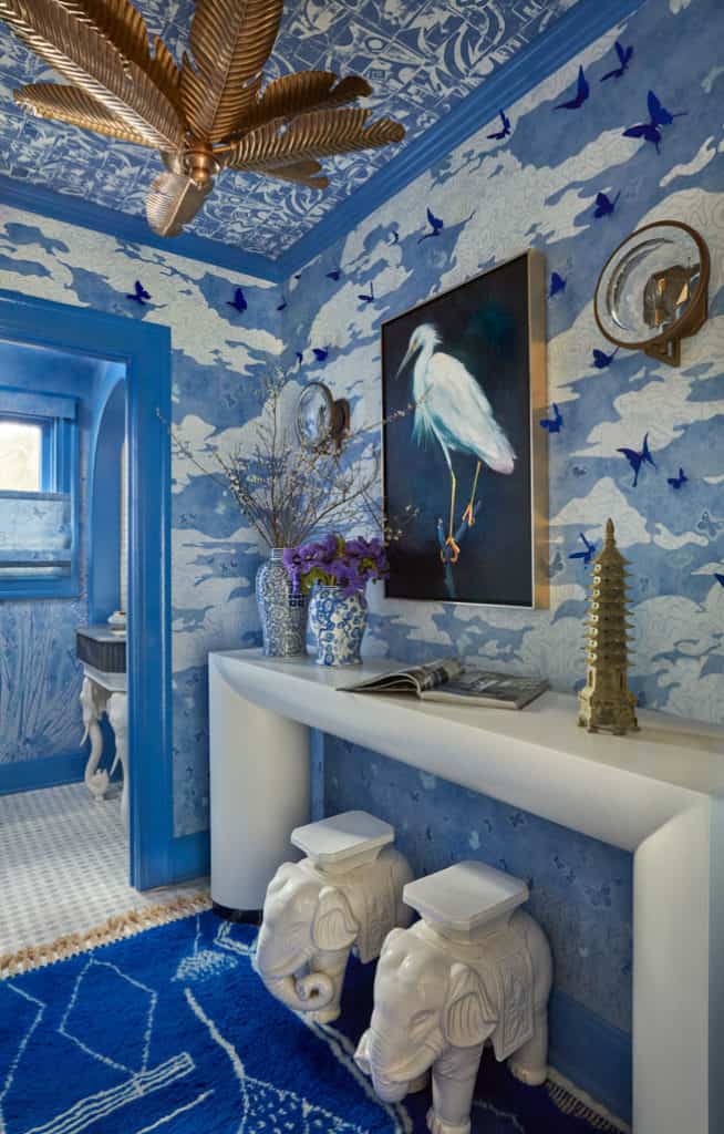 Kips Bay Palm Beach Showhouse Powder Foyer with blue wallpaper and blue rug