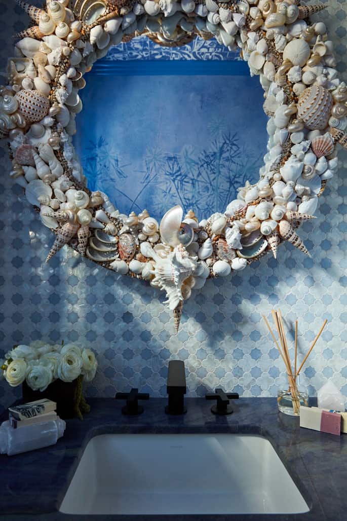 Detail image of powder room shell mirror and blue stone mosaic tile