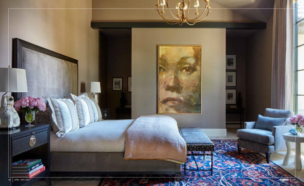 luxury bedroom with a painting of a face