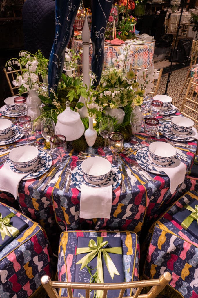 elaborate table design with multi color female silhouettes for party by Andrea Schumacher Interior Design