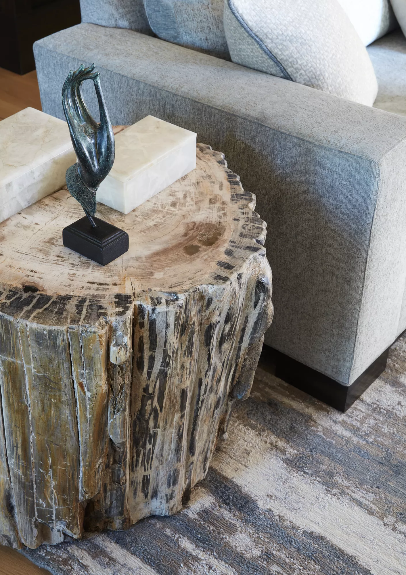unique side table in neutral living room by denver interior decorator