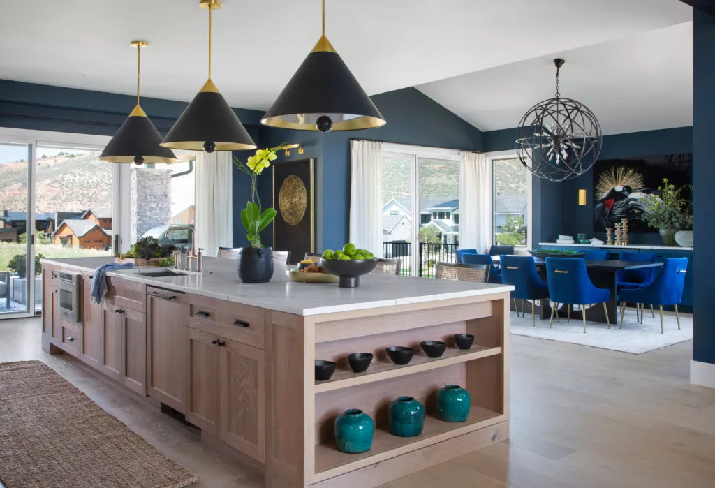 Contemporary custom kitchen island with brass lighting overhead