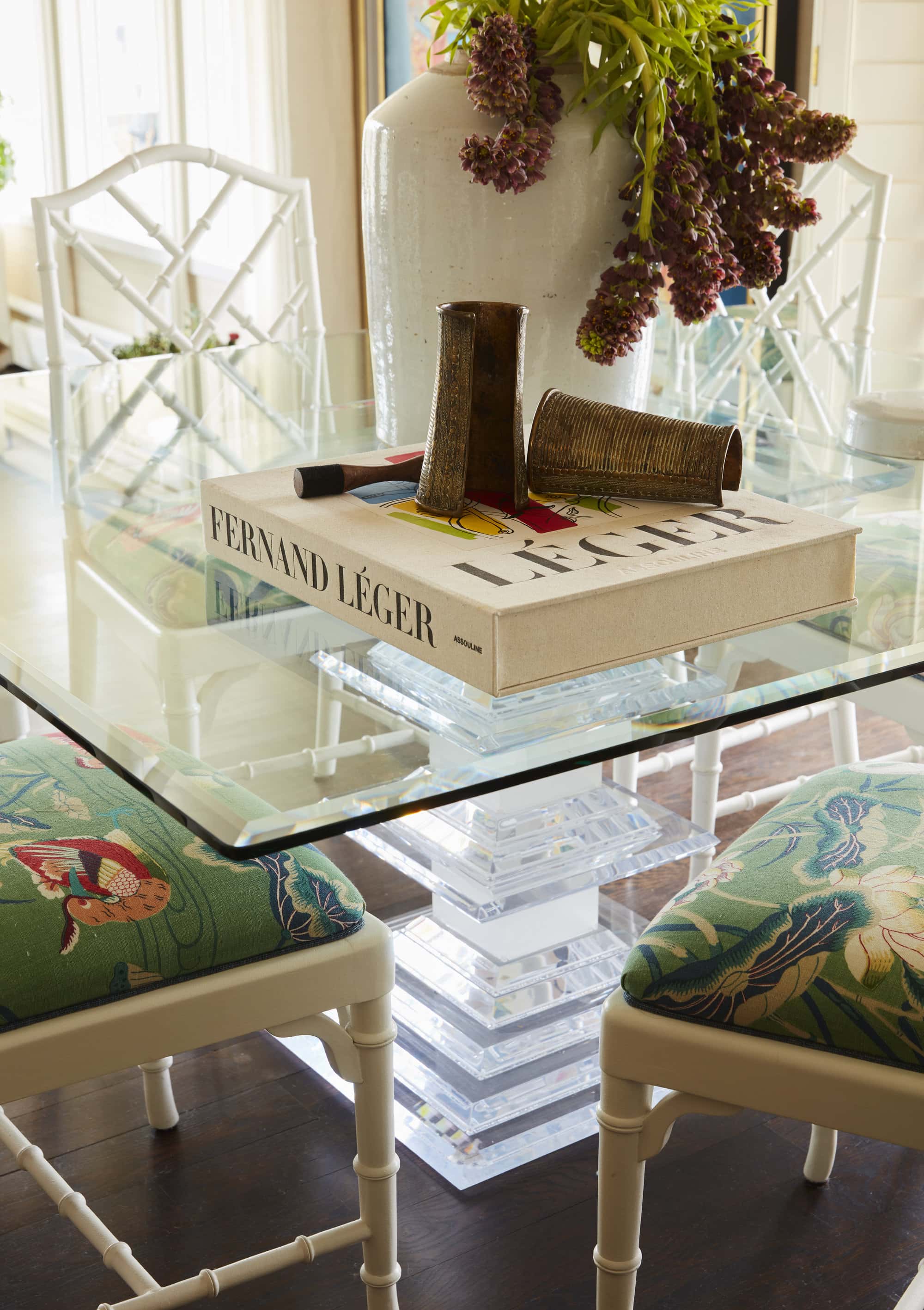 Custom upholstered dining chairs with unique glass table