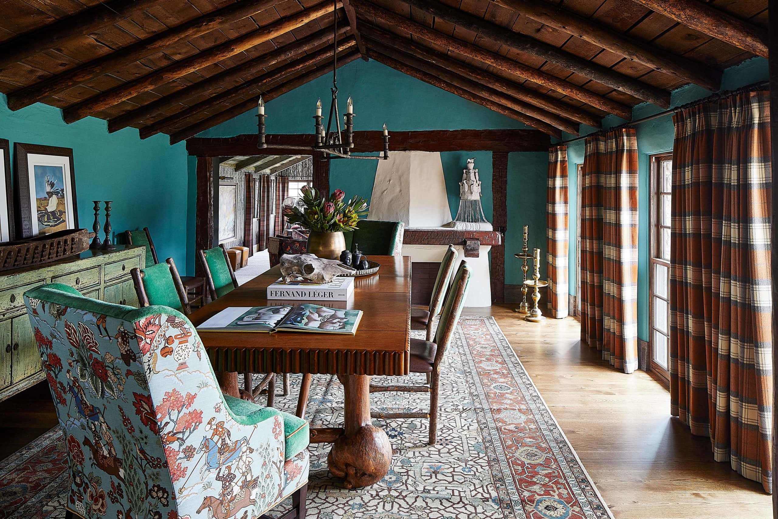 Modern Ranch Interior Design dining room with plaid draperies, huge rug, solid wood table, and Asian print chairs.