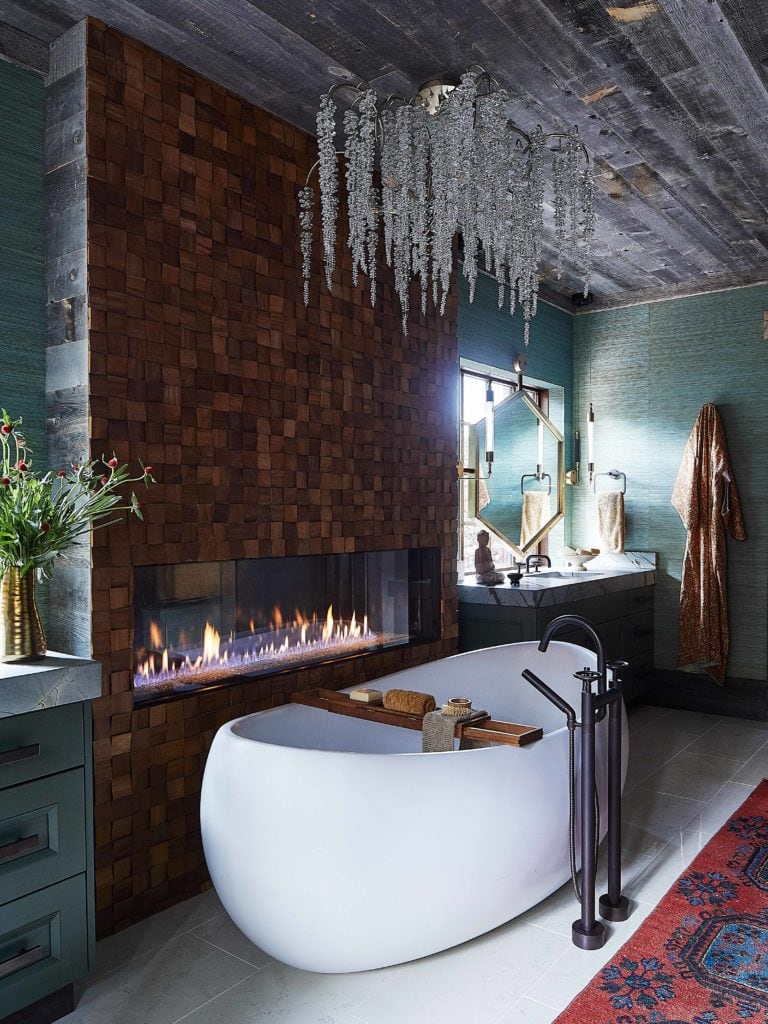Remount Ranch Home Interiors luxury farmhouse bathroom floral crystal chandelier and fireplace.