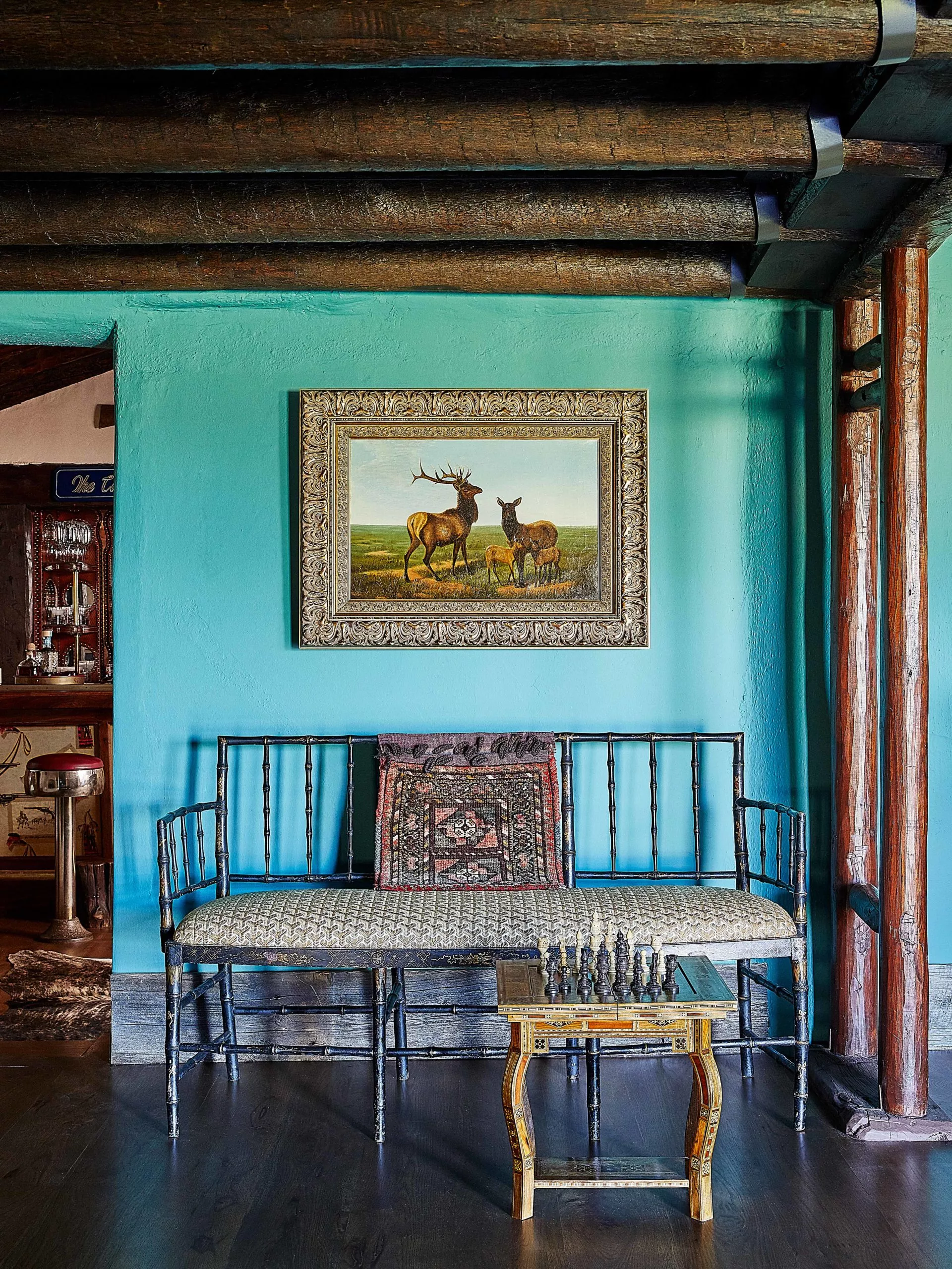 Modern ranch entry sitting area in Sherwin Williams Surf Green.