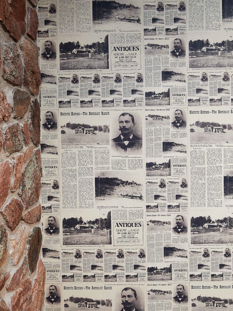 Custom wallpaper made from a real newspaper clipping on Remount Ranch.