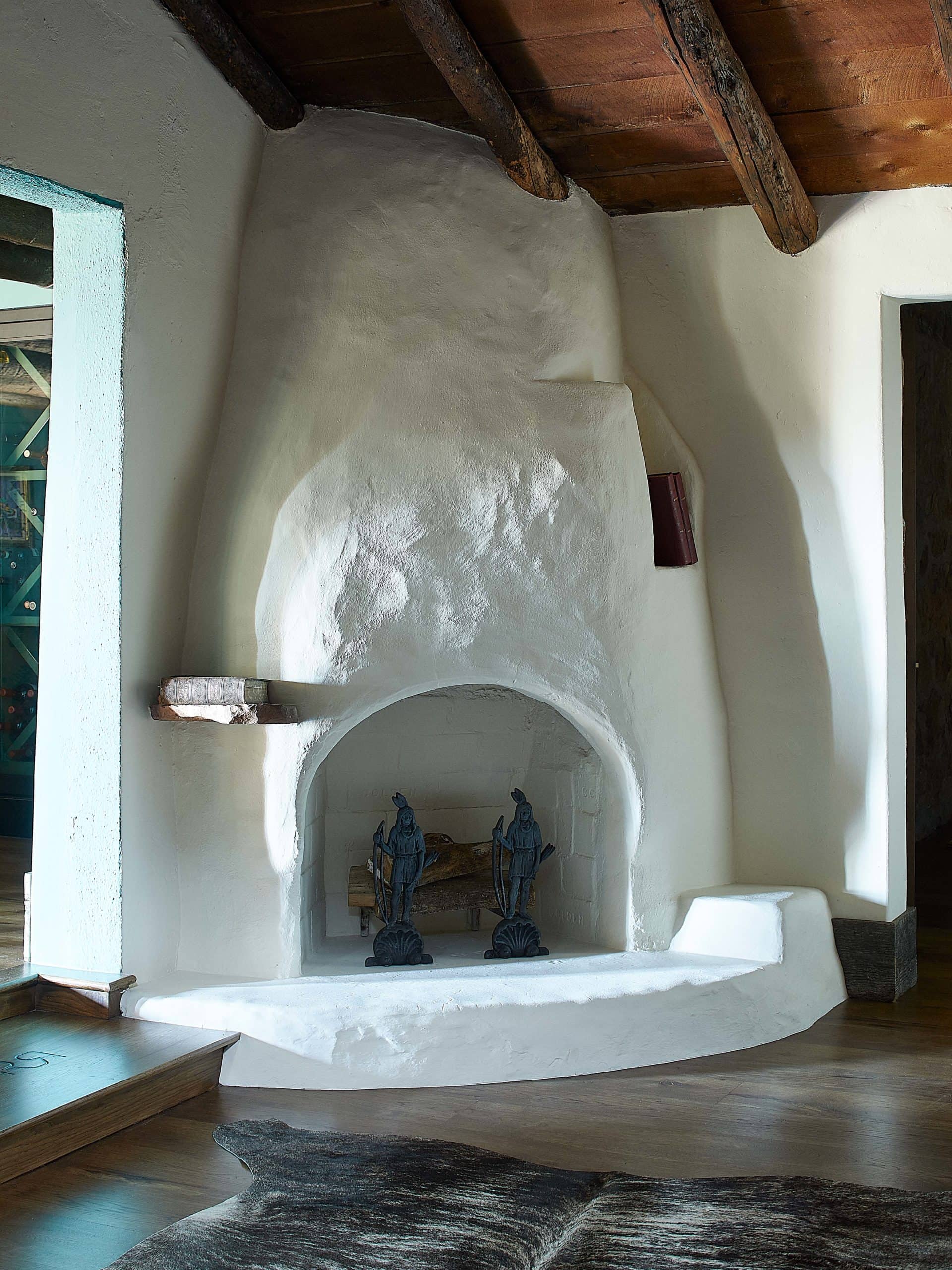 The famous white stucco fireplace from Remount Ranch in Wyoming. Original to the home.