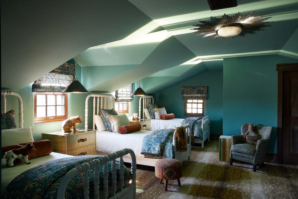 Blue children's room with three twin size beds, custom roman shades match bedding in Remount Ranch Home Interiors
