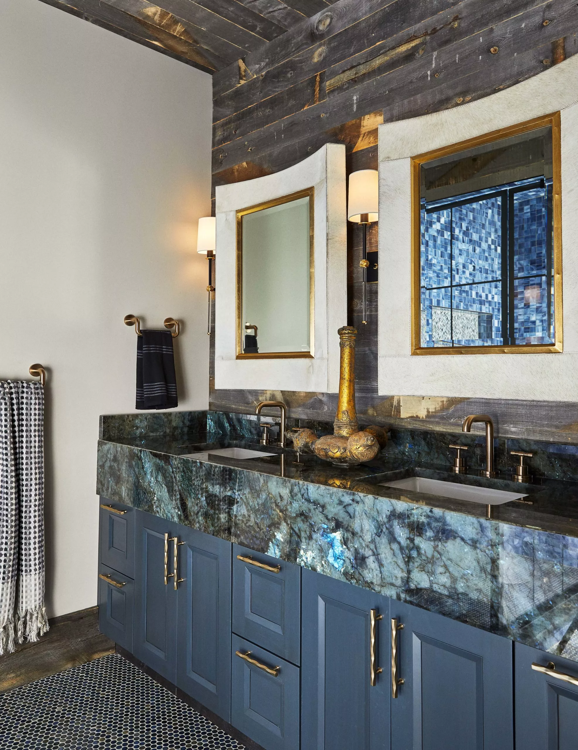 contemporary farmhouse interior design bathroom design with barnwood paneling and blue stone counter top