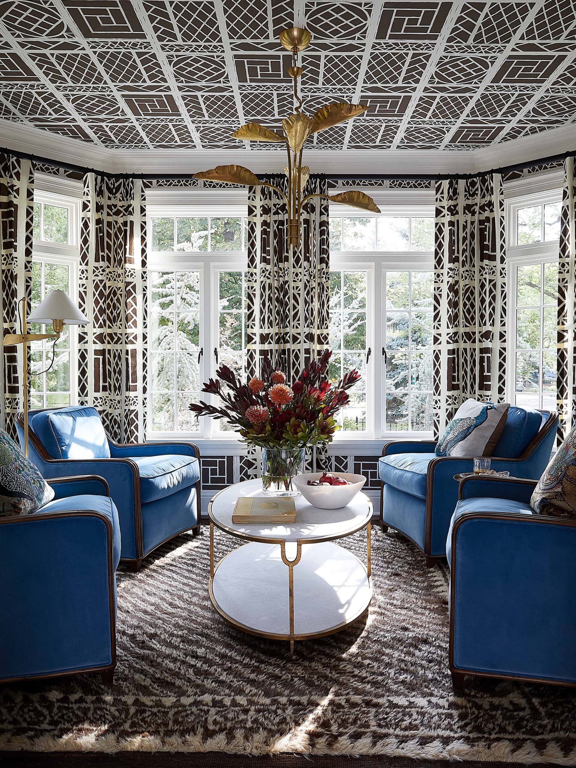 Tudor Revival City Style sunroom with lattice wallpaper on the ceiling and brass chandelier