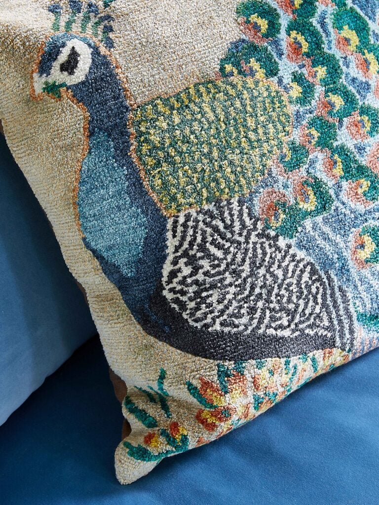 Decorative pillow with a peacock print